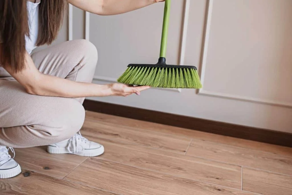 cleaning off broom